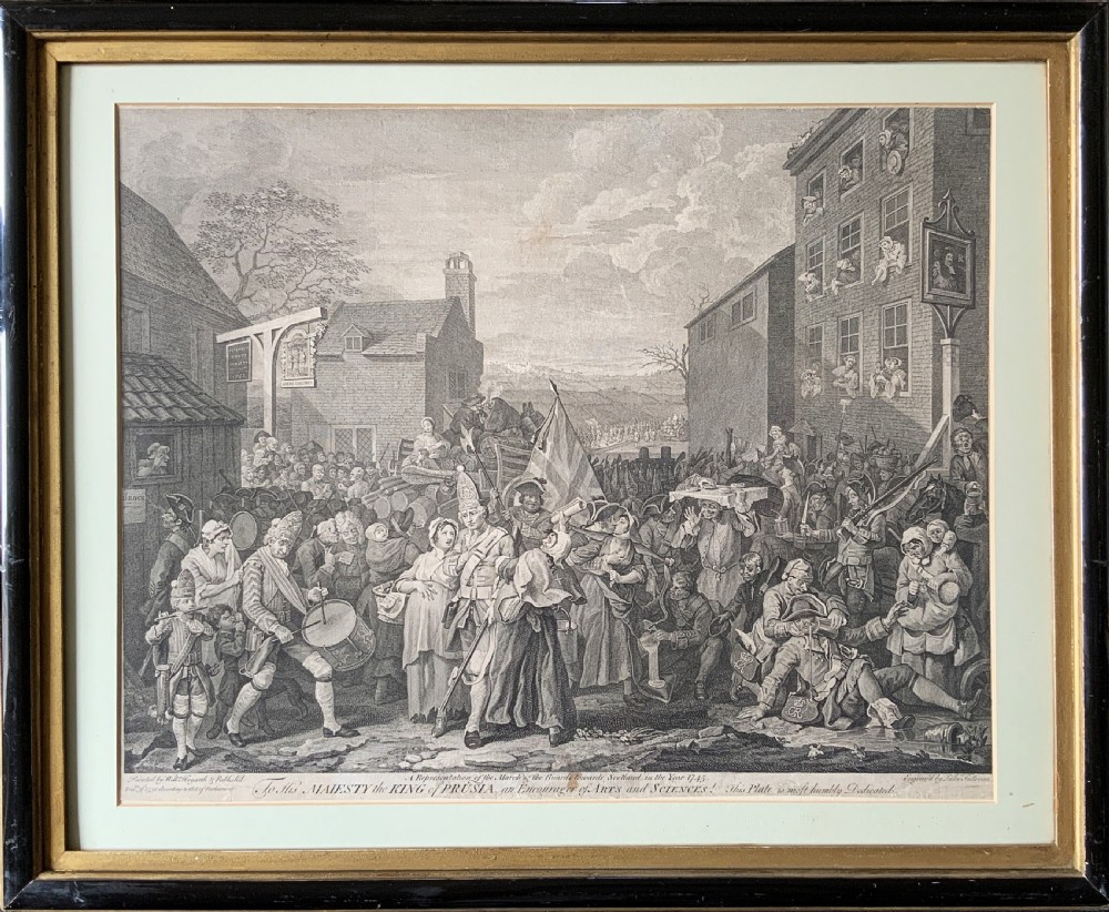 An 18th-century black and white satirical engraving depicting a crowded street scene with soldiers, housed in a black and gold frame with a cream mount.