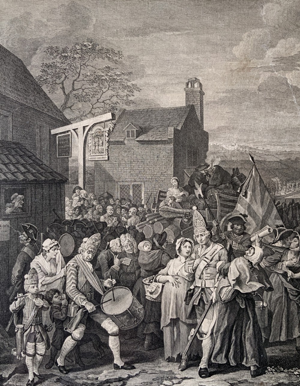 An 18th-century black and white satirical engraving depicting a crowded street scene with soldiers, housed in a black and gold frame with a cream mount. View IX