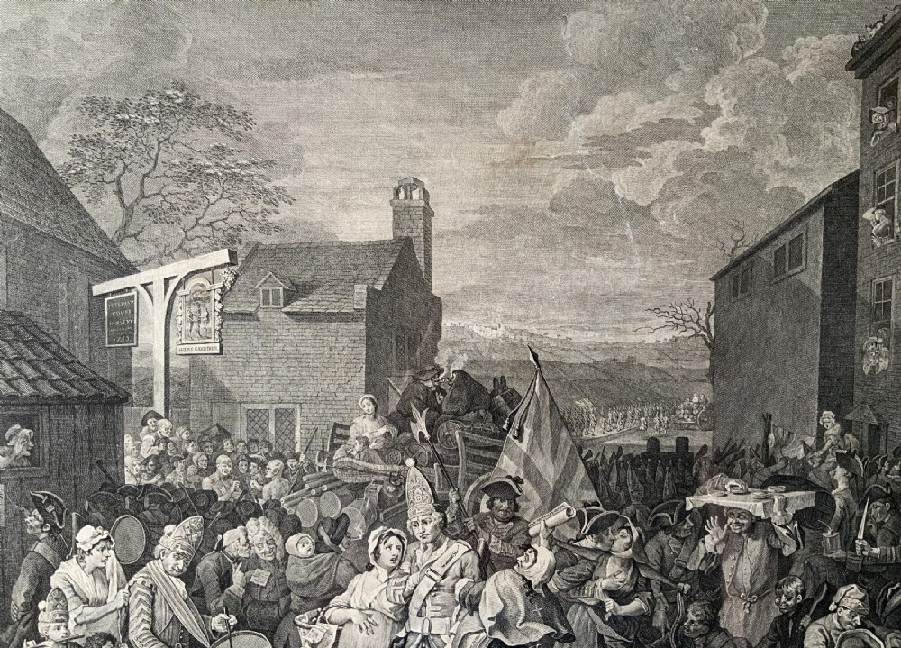 An 18th-century black and white satirical engraving depicting a crowded street scene with soldiers, housed in a black and gold frame with a cream mount. View X