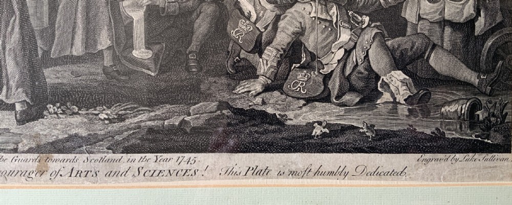 An 18th-century black and white satirical engraving depicting a crowded street scene with soldiers, housed in a black and gold frame with a cream mount. View XII