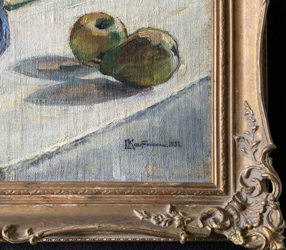 A framed 1931 impressionist oil painting depicting a vase of colourful flowers, a brass kettle, and fruit on a white draped table. View XIV