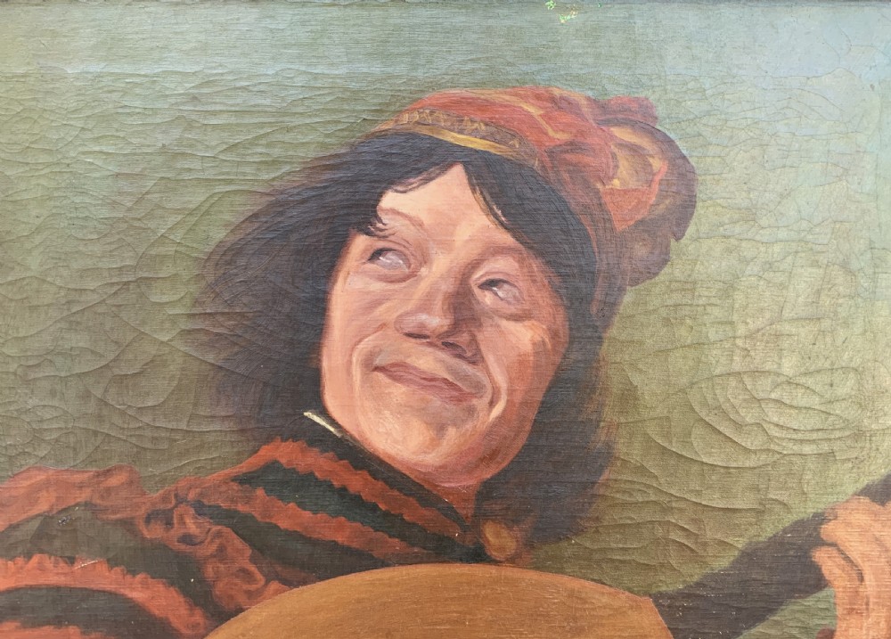 An oil painting on canvas depicting a seated musician playing a lute in a red and black striped tunic against an olive green background, housed within a dark carved frame. View V