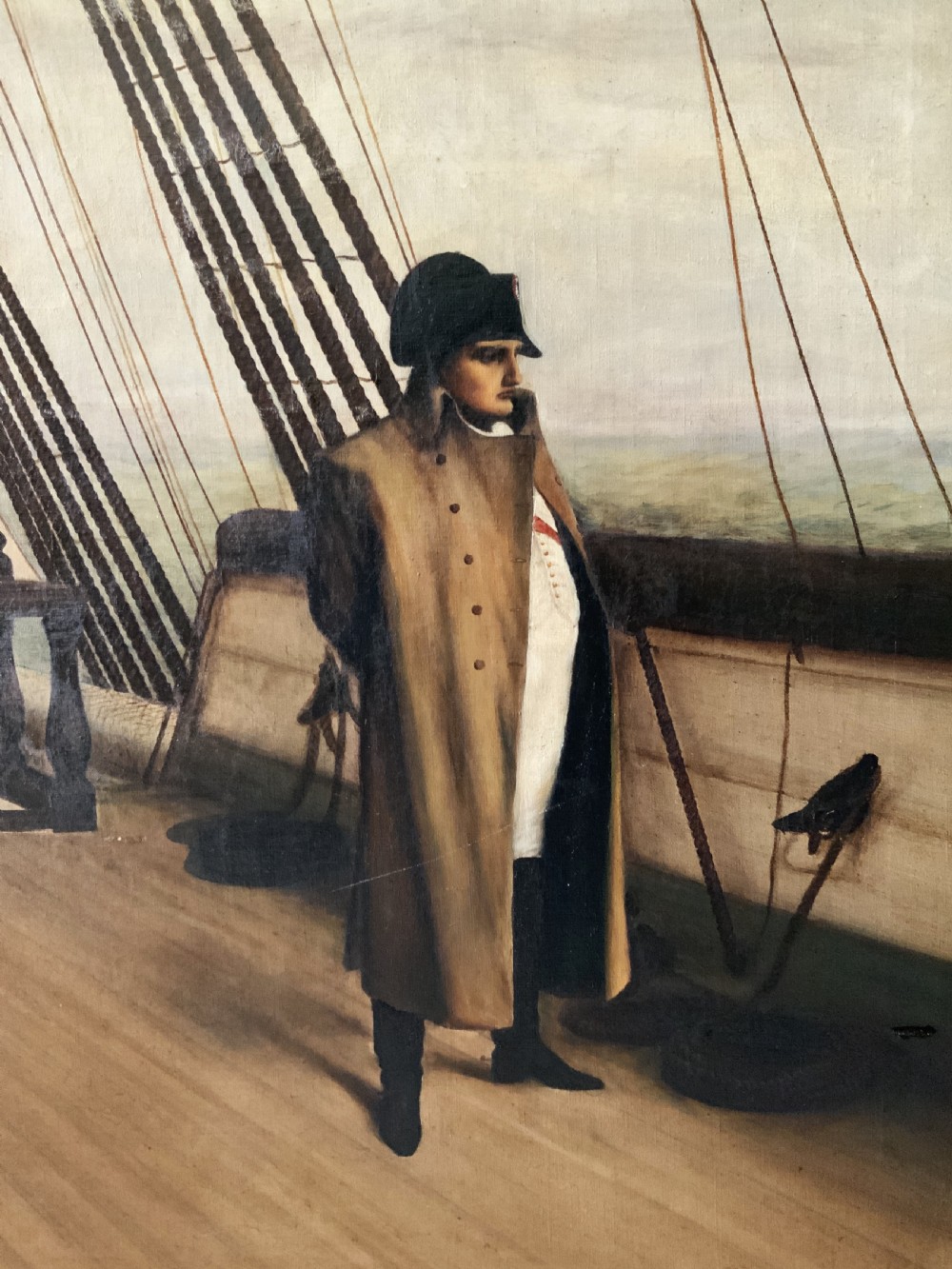 A large horizontal oil painting depicting Napoleon Bonaparte standing on a wooden ship deck surrounded by naval staff. View XVI