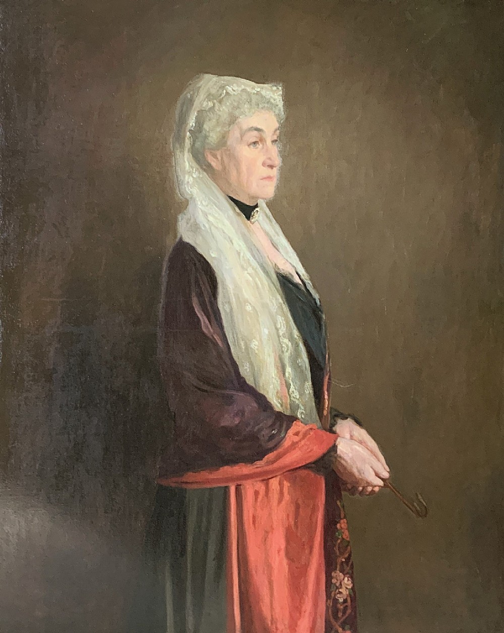 A pair of large 19th-century oil paintings depicting a gentleman in military uniform and a lady in formal dress, framed in heavy gilded mouldings. View IX