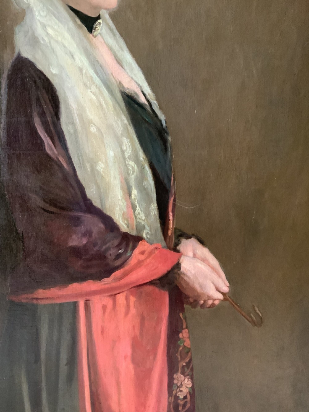 A pair of large 19th-century oil paintings depicting a gentleman in military uniform and a lady in formal dress, framed in heavy gilded mouldings. View XII