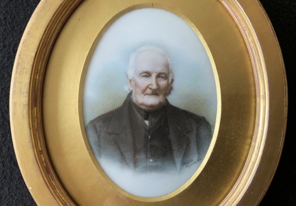An oval Victorian miniature watercolour portrait of an elderly gentleman in a dark suit, set within a gilded frame. View III