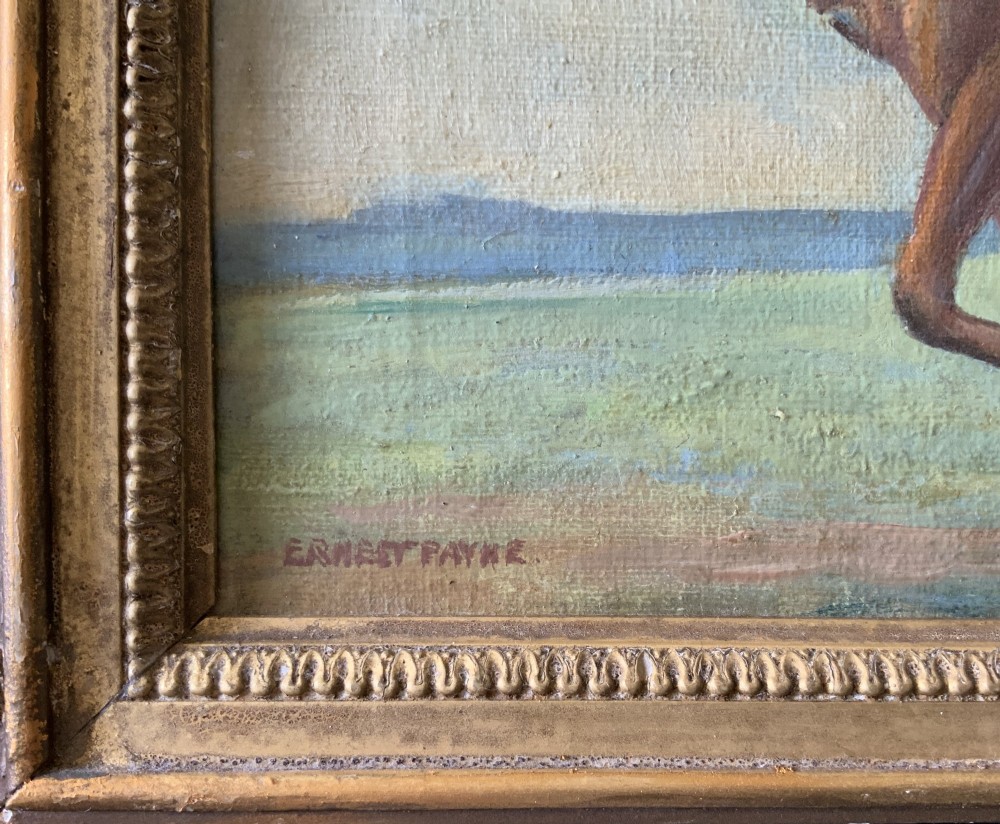 An antique oil painting depicting a jockey riding a brown racehorse across a green landscape against a blue sky, set within a gilded frame. View IX