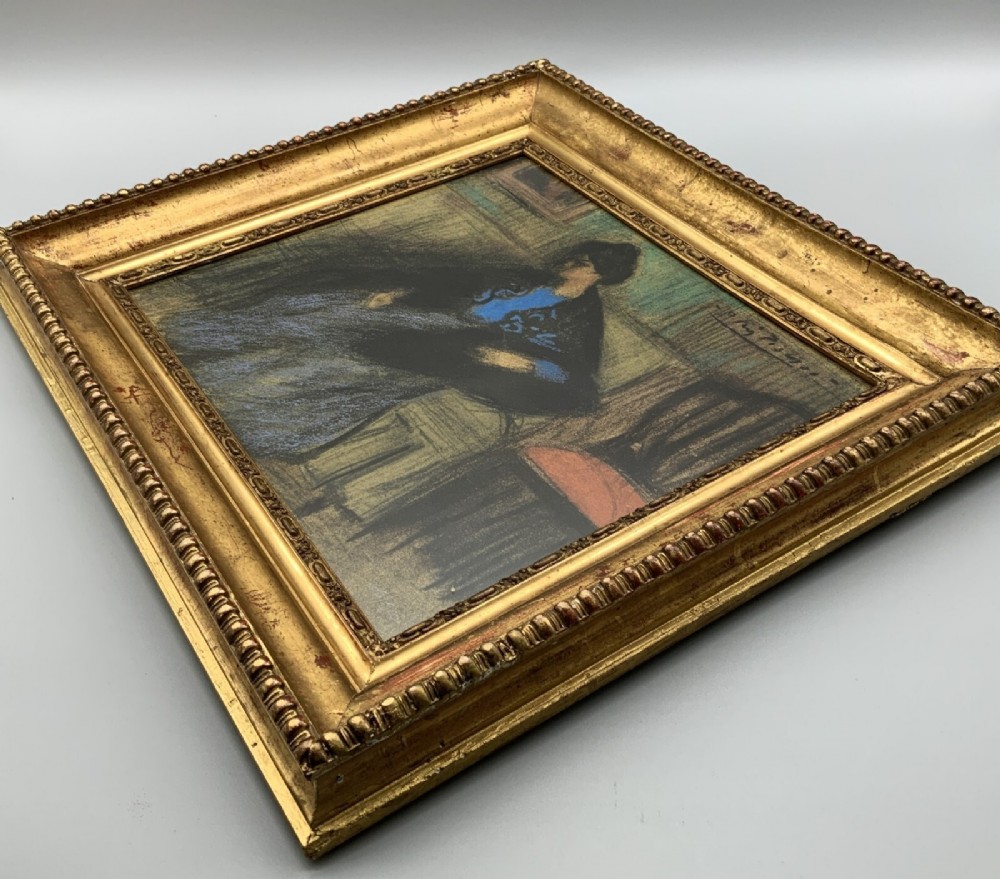 A framed limited-edition portrait print depicting a seated woman in a blue top and dark shawl, housed within a wide gilt decorative frame. View V