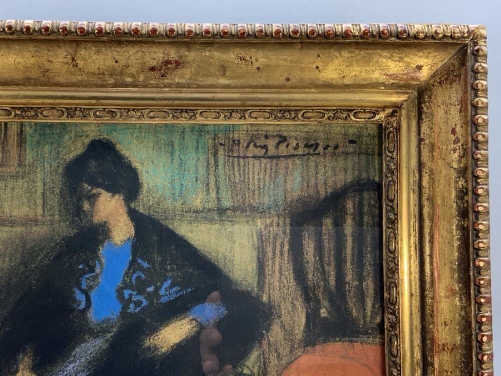 A framed limited-edition portrait print depicting a seated woman in a blue top and dark shawl, housed within a wide gilt decorative frame. View VII