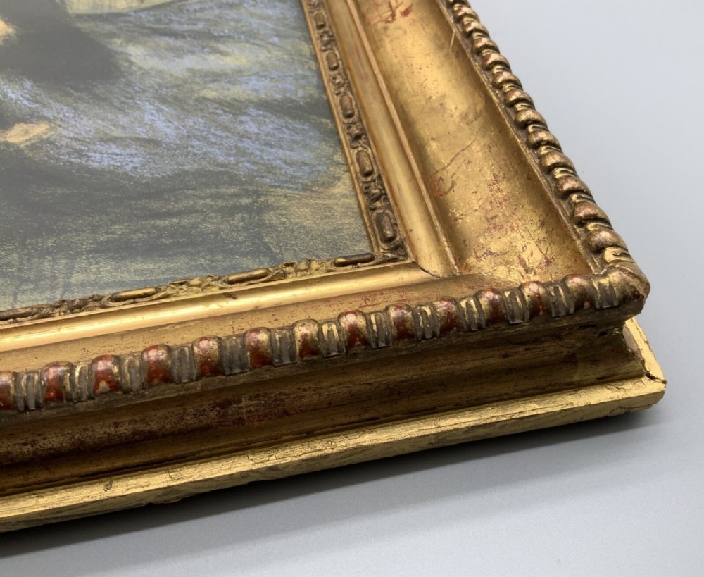 A framed limited-edition portrait print depicting a seated woman in a blue top and dark shawl, housed within a wide gilt decorative frame. View X