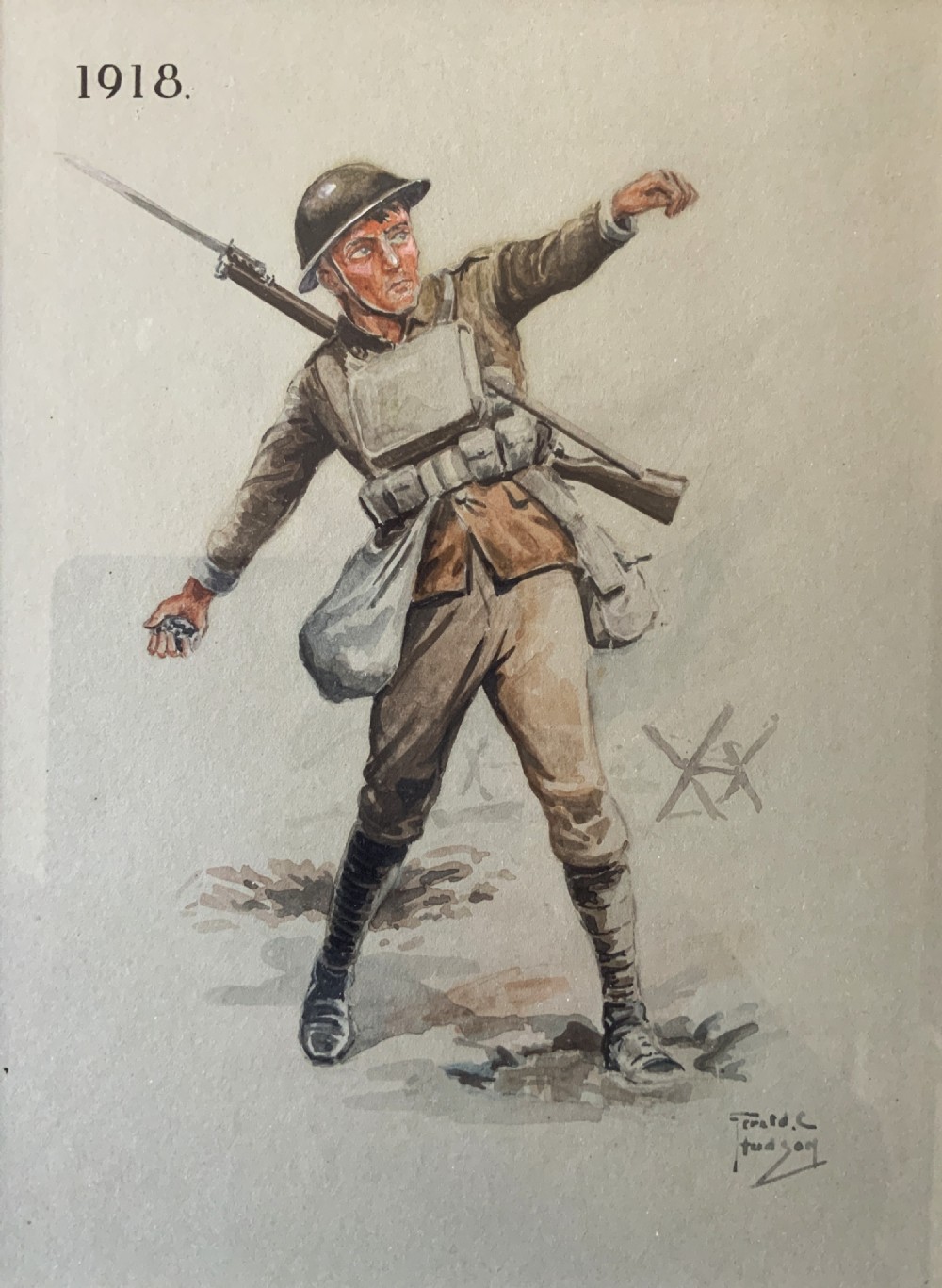 A framed watercolour painting depicting a 1918 British soldier in full military uniform with a rifle and Brodie helmet. View II