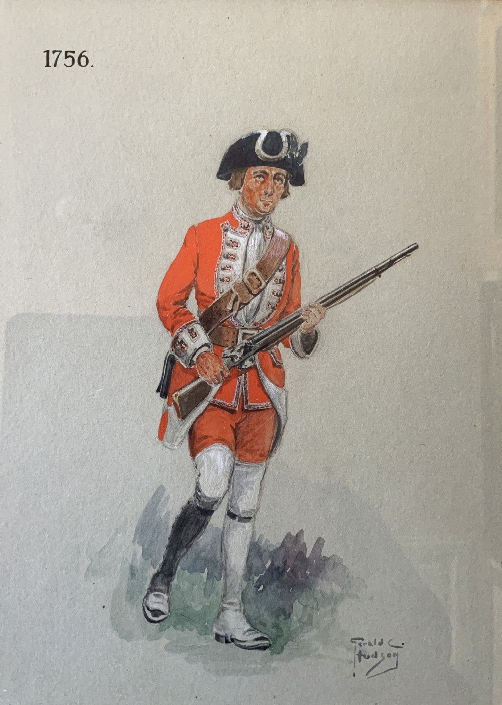 A framed watercolour painting depicting a 1756 British soldier in a red uniform holding a musket within a green mount and gilt frame. View II