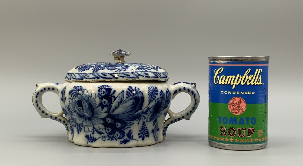 A 17th-century English Delftware lidded pot painted with cobalt blue floral motifs, featuring two side loop handles and a knopped lid. View III