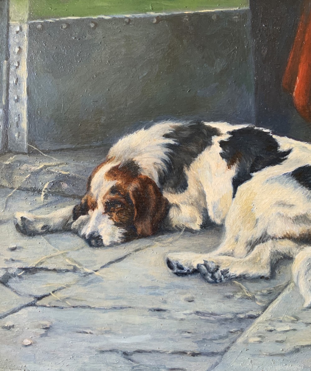 An oil painting depicting a resting tri-colour foxhound lying on a stone floor inside a doorway, housed in an ornate gilt frame. View VII