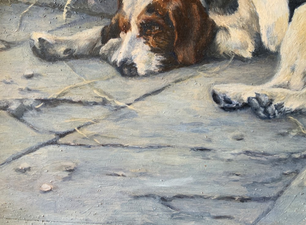 An oil painting depicting a resting tri-colour foxhound lying on a stone floor inside a doorway, housed in an ornate gilt frame. View IX