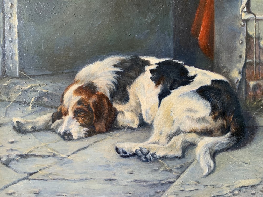 An oil painting depicting a resting tri-colour foxhound lying on a stone floor inside a doorway, housed in an ornate gilt frame. View XII