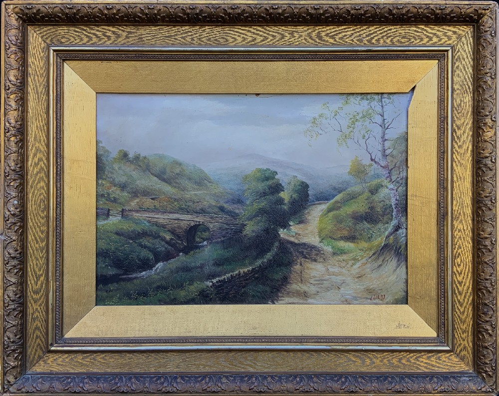 A 19th-century Victorian oil painting depicting a British rural landscape with a stone arch bridge, framed in an ornate gilded wooden frame.