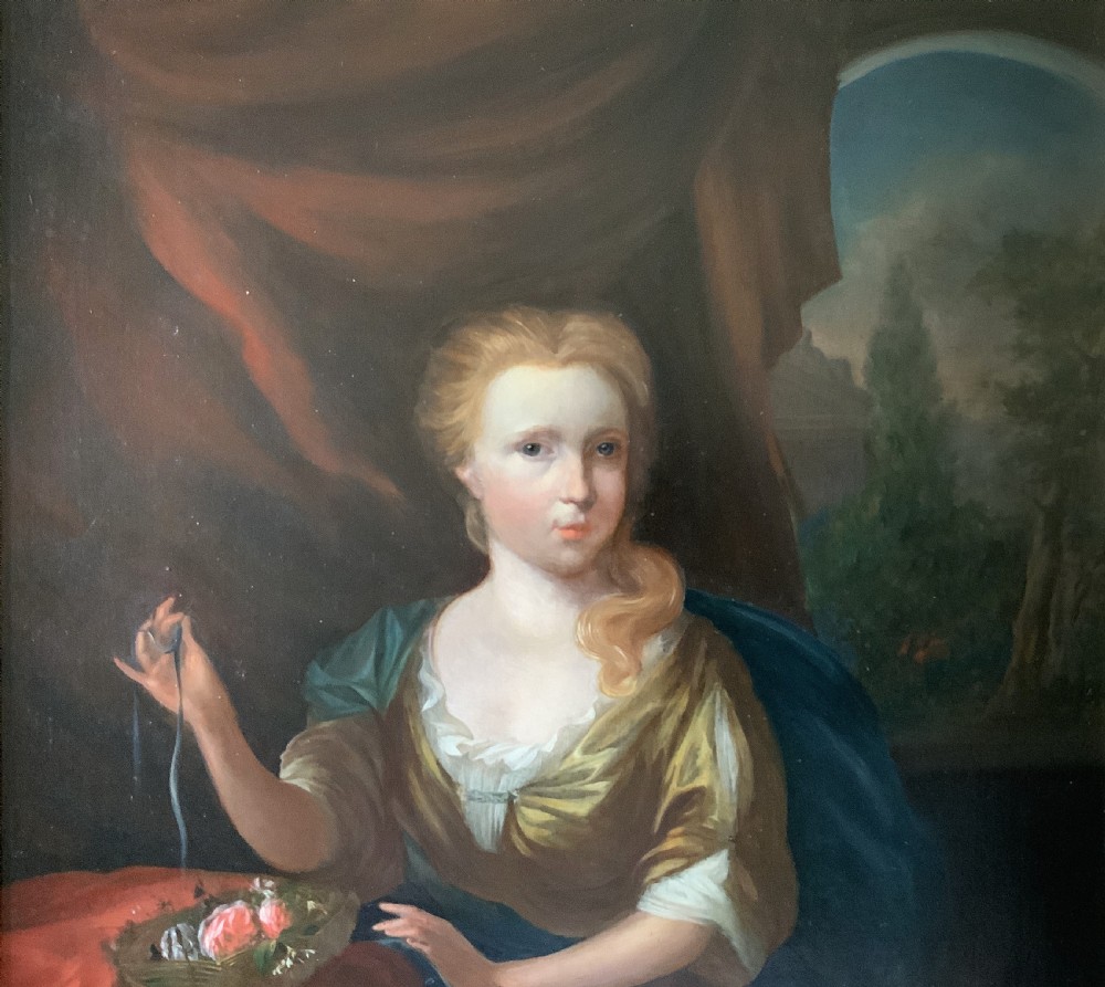 An antique oil painting depicting a seated woman beside a basket of flowers on a draped table, set within a gilded wooden frame. View IV