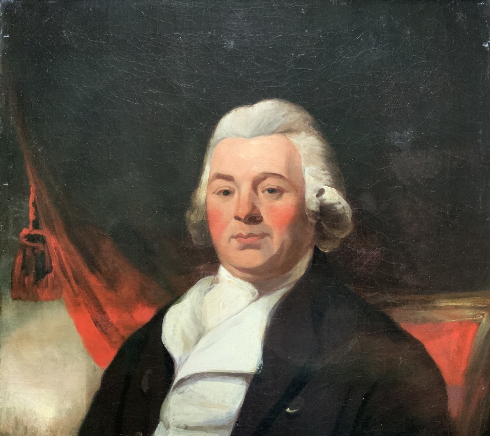 An antique oil painting on canvas depicting a gentleman in Georgian attire within an ornate gilt frame. View V