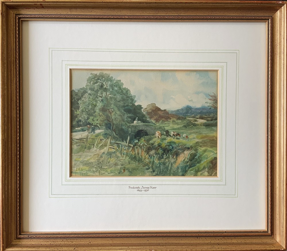 A framed antique watercolour painting depicting cattle grazing in a rural landscape, set within a layered mount and a moulded gilt frame.