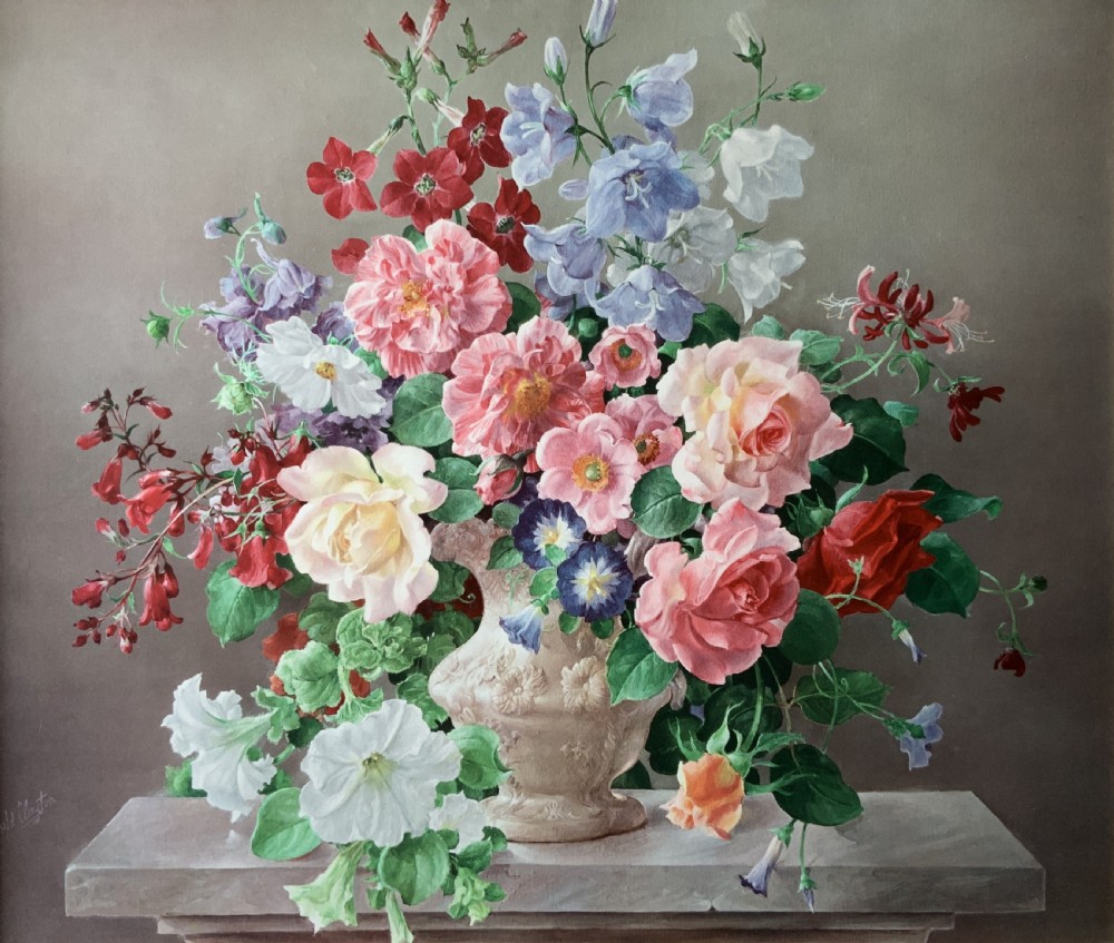 A framed oleograph print depicting a bouquet of pink, red, and blue garden flowers in an ornate ceramic urn on a stone ledge, enclosed within a decorative gilded frame. View III