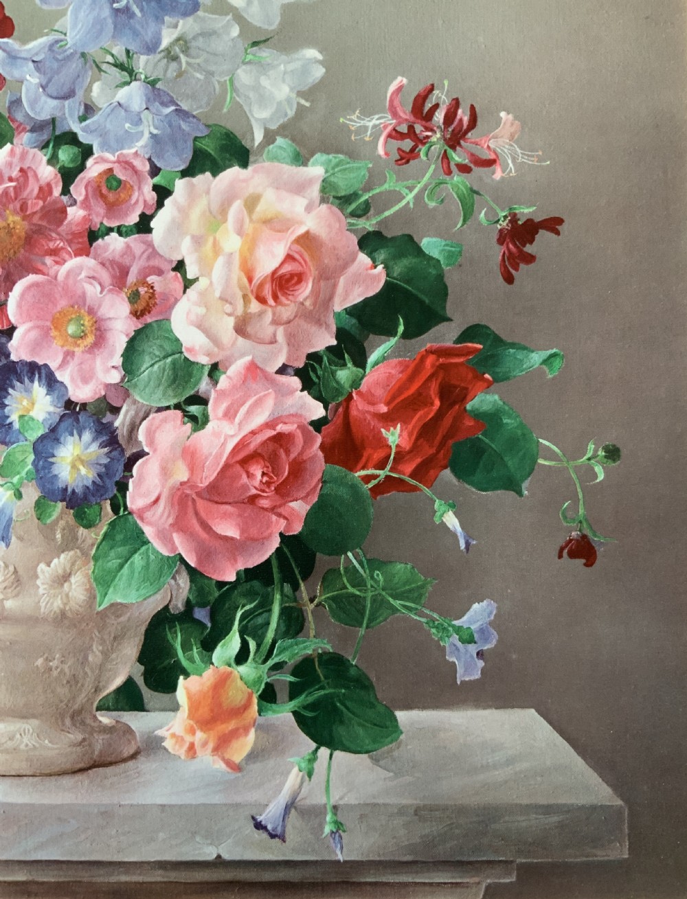 A framed oleograph print depicting a bouquet of pink, red, and blue garden flowers in an ornate ceramic urn on a stone ledge, enclosed within a decorative gilded frame. View VIII