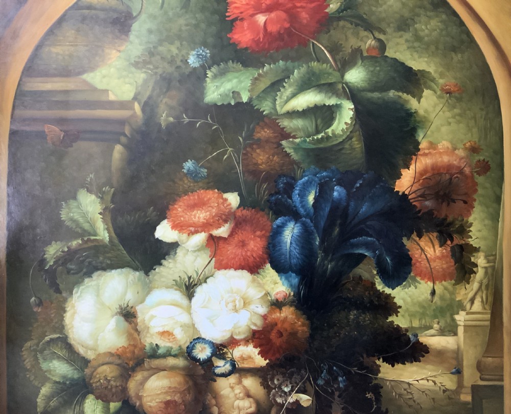 A monumental oil painting depicting a detailed floral arrangement in a stone classical urn set within an architectural stone arch. View IV
