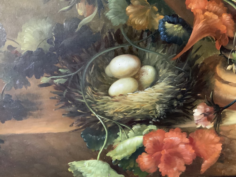A monumental oil painting depicting a detailed floral arrangement in a stone classical urn set within an architectural stone arch. View XII