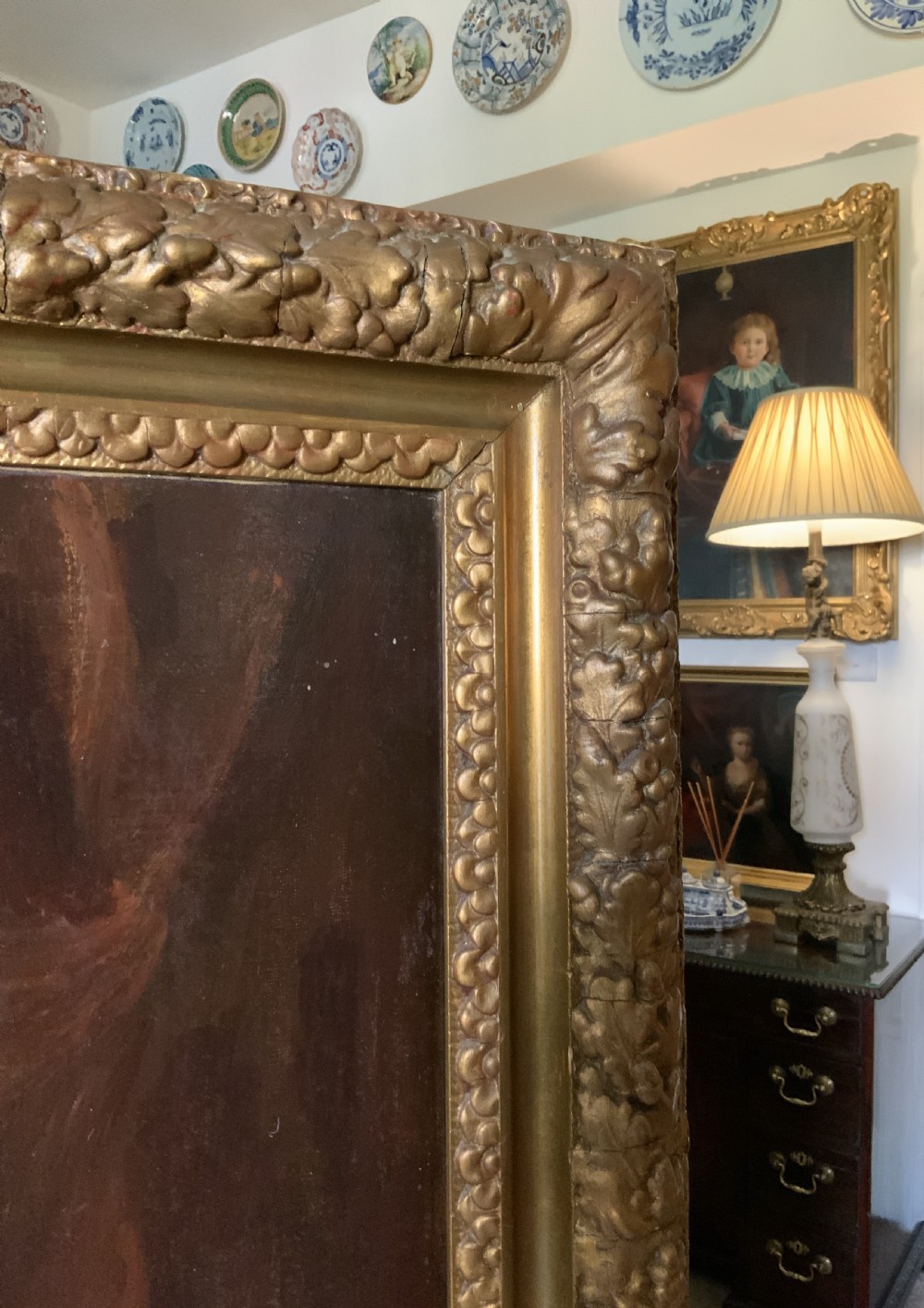 An antique oil painting depicting a military officer in formal dress uniform with medals, housed inside an ornate gilded wooden frame. View XI
