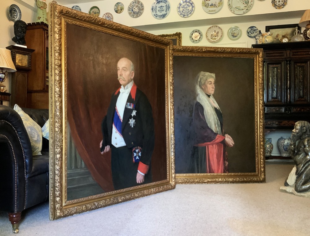 An antique oil painting depicting a military officer in formal dress uniform with medals, housed inside an ornate gilded wooden frame. View XII