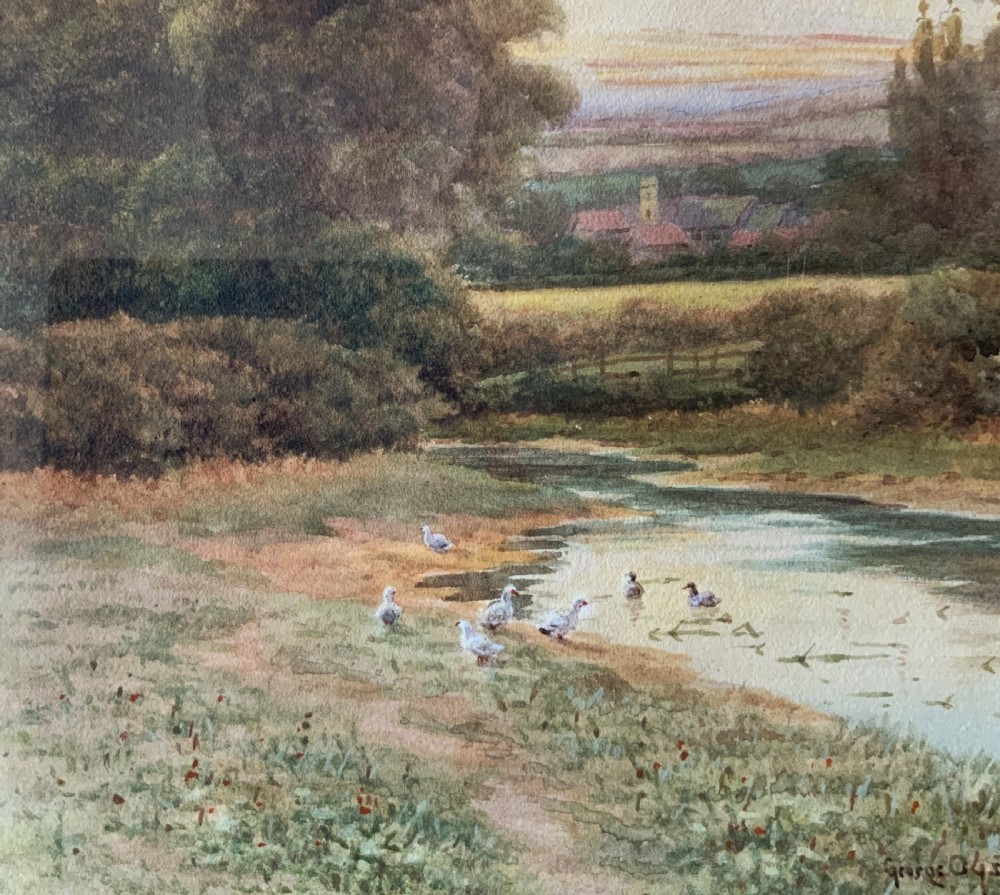 A framed watercolour painting depicting a tranquil river landscape in Buckinghamshire with trees and birds, set inside a gold mount and beaded gilt frame. View VII
