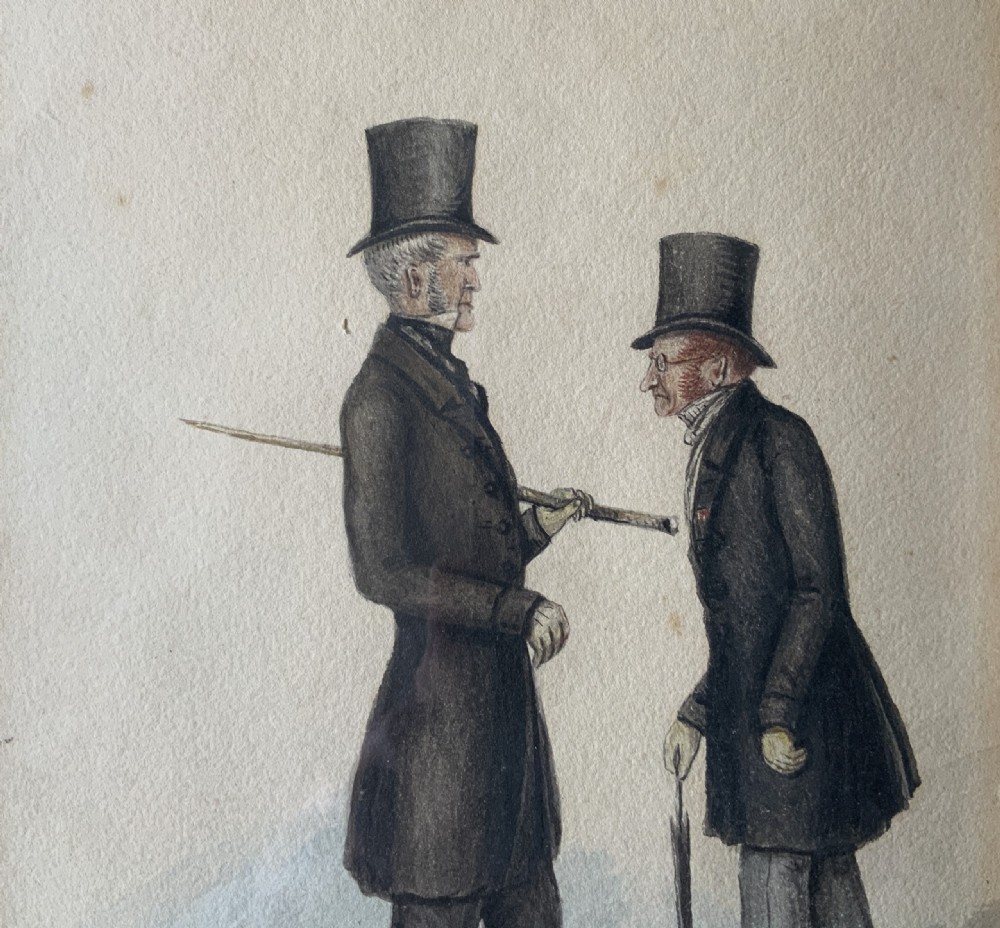 A framed 19th-century watercolour illustration depicting two men in top hats and tailcoats standing in profile. View V