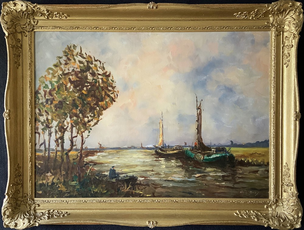 An impressionistic Dutch canalscape oil painting depicting traditional barges alongside a grassy riverbank, housed in an ornate carved gold frame.