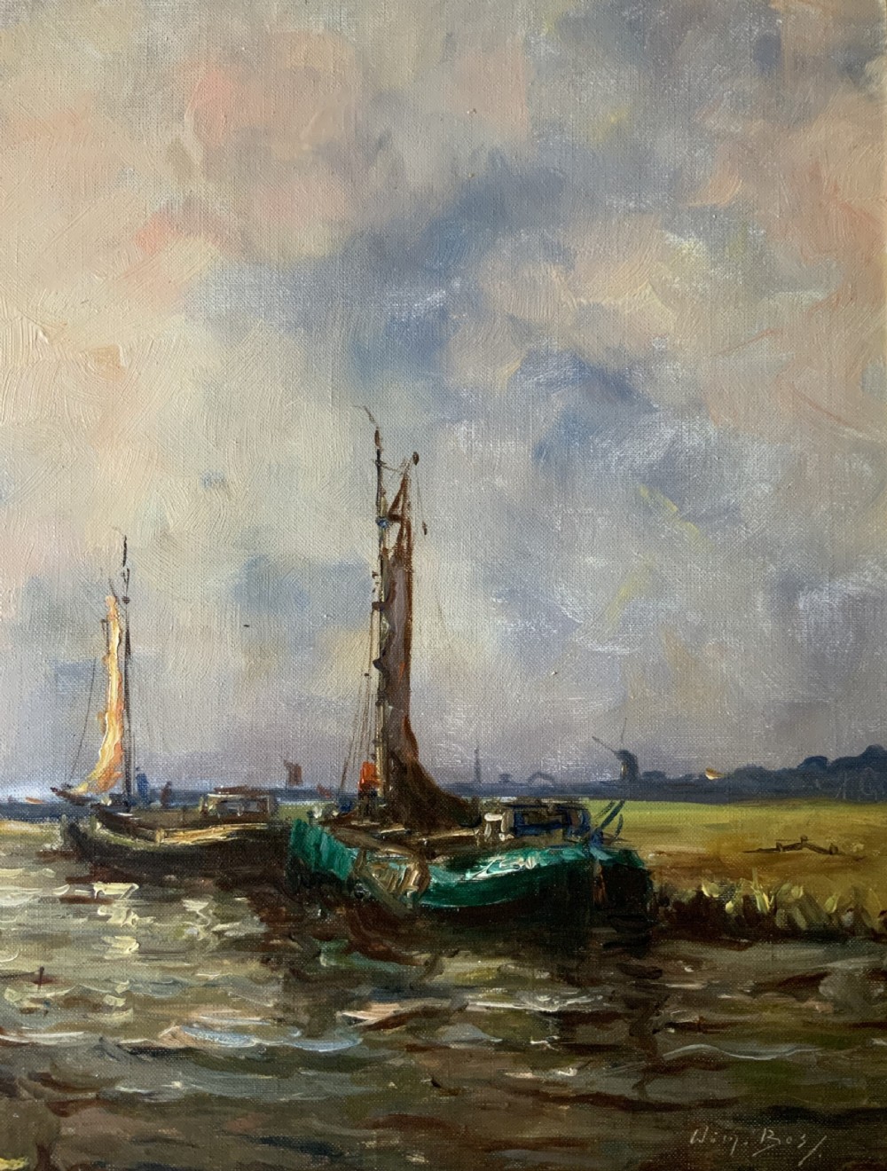 An impressionistic Dutch canalscape oil painting depicting traditional barges alongside a grassy riverbank, housed in an ornate carved gold frame. View IV