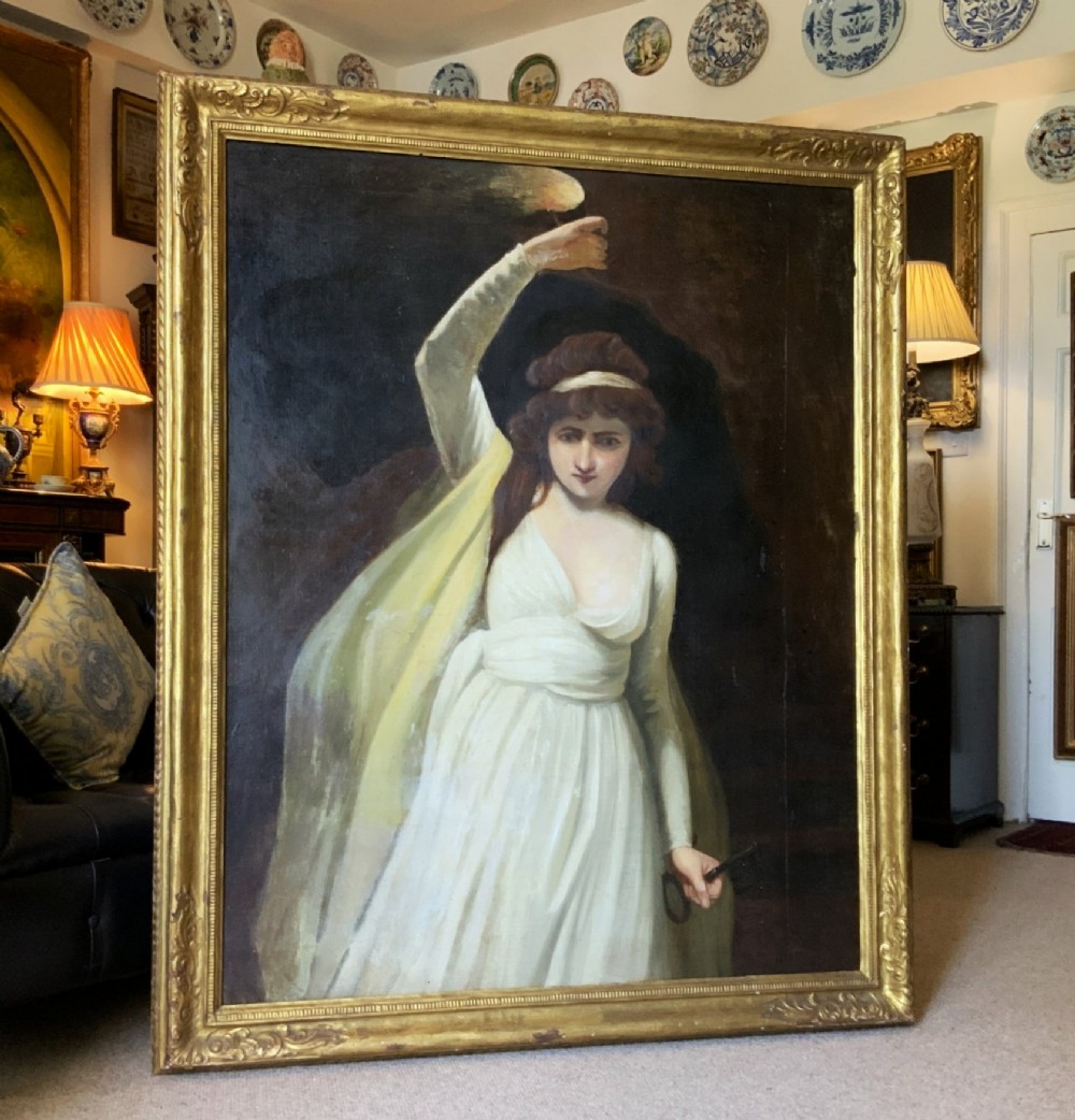 A large gilt-framed Georgian oil painting on canvas depicting a woman in white classical drapery holding a torch against a dark background.