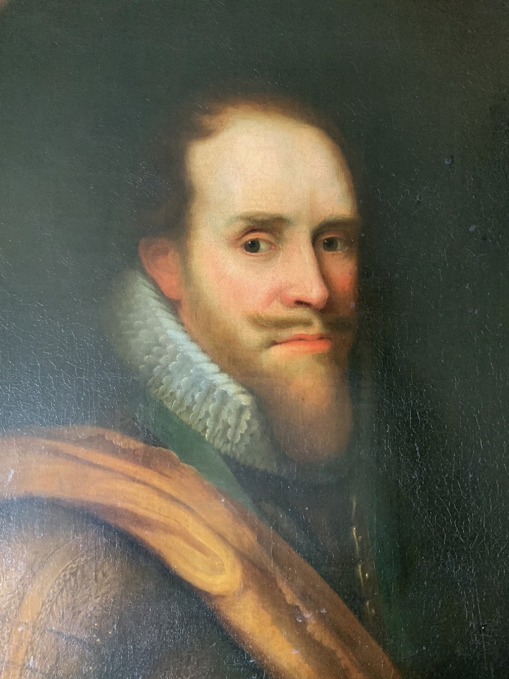 A 17th-century Dutch Old Master oil portrait of a man with a beard, lace ruff, and armour, presented in a light-coloured moulded wooden frame. View IV