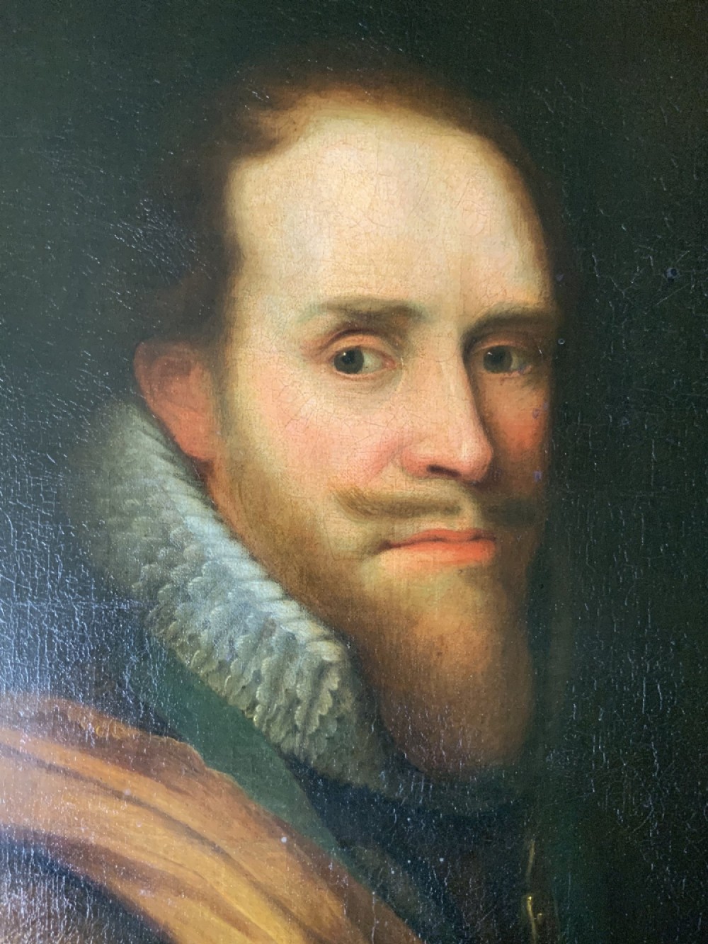 A 17th-century Dutch Old Master oil portrait of a man with a beard, lace ruff, and armour, presented in a light-coloured moulded wooden frame. View VII
