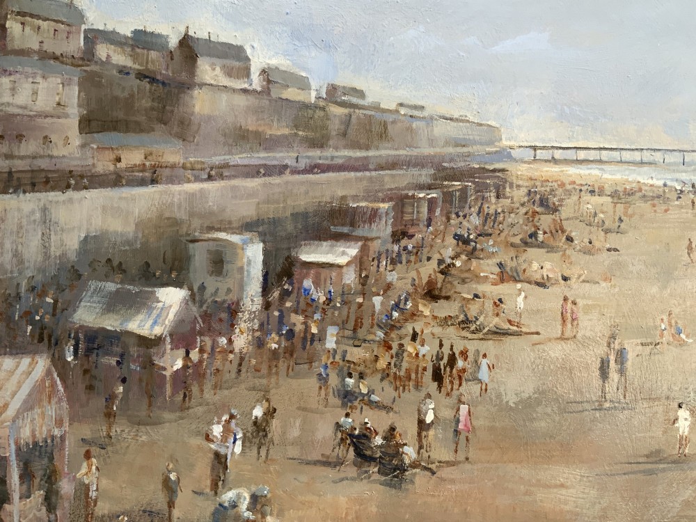 An impressionist oil painting on board depicting a crowded British seaside beach with a pier in the distance, housed in a gilt frame with a fabric liner. View XI