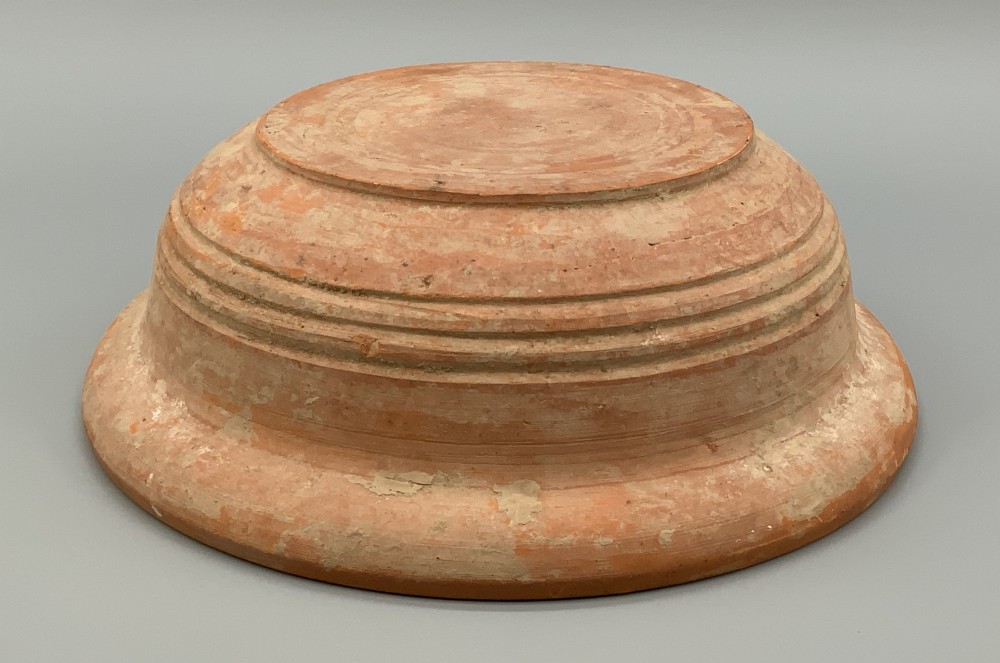 A pair of circular Han Dynasty red terracotta pottery basins featuring broad everted rims and horizontal exterior grooves. View VII