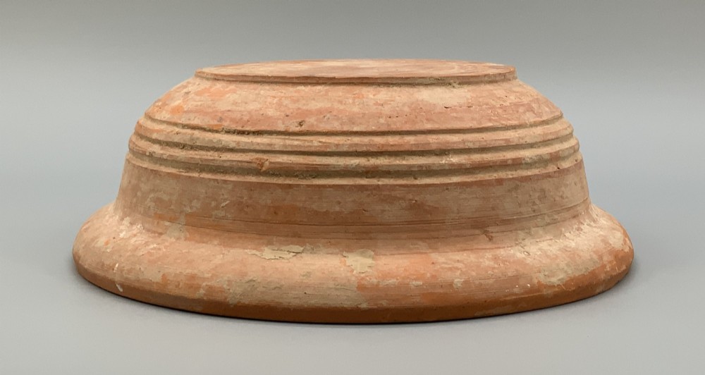 A pair of circular Han Dynasty red terracotta pottery basins featuring broad everted rims and horizontal exterior grooves. View VIII