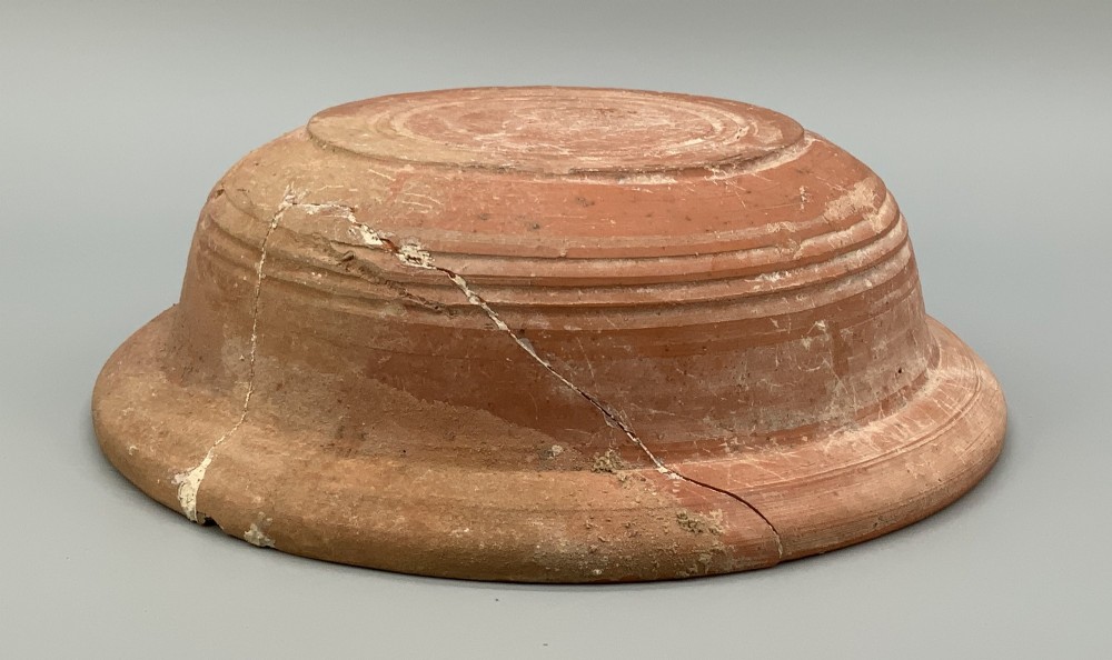A pair of circular Han Dynasty red terracotta pottery basins featuring broad everted rims and horizontal exterior grooves. View XI