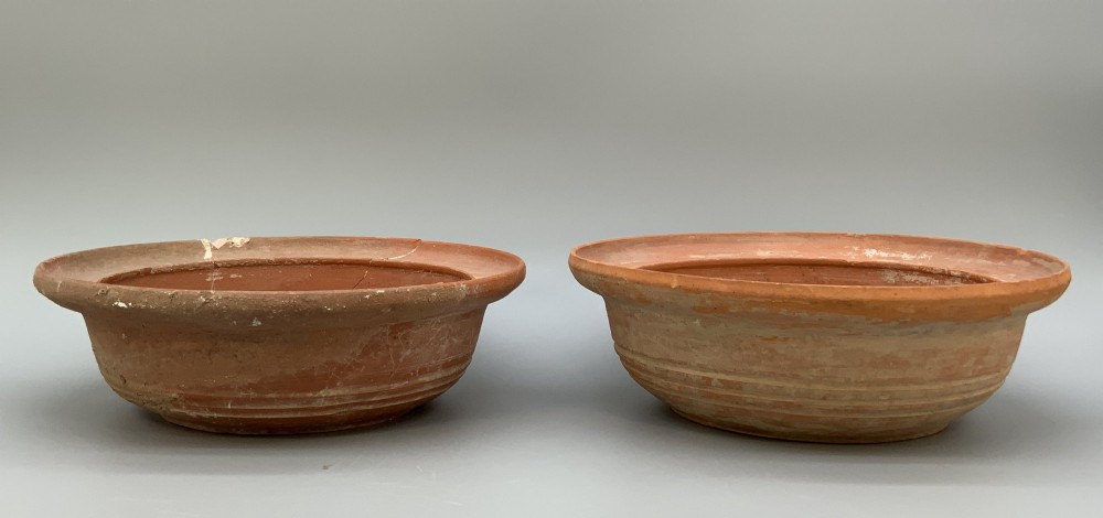 A pair of circular Han Dynasty red terracotta pottery basins featuring broad everted rims and horizontal exterior grooves. View XIII