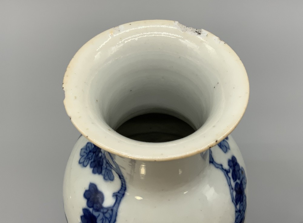 A pair of flared Chinese blue and white porcelain vases hand painted with figural court ladies amidst floral motifs. View XII