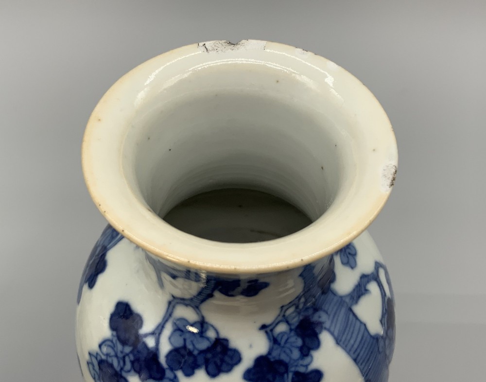 A pair of flared Chinese blue and white porcelain vases hand painted with figural court ladies amidst floral motifs. View XIII