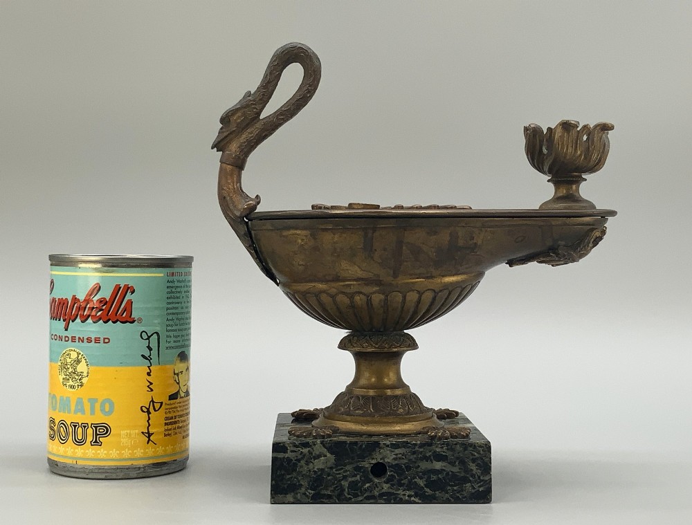 A nineteenth-century Grand Tour patinated bronze oil lamp featuring a serpent handle and gadrooned body, mounted on a square green marble base. View VI