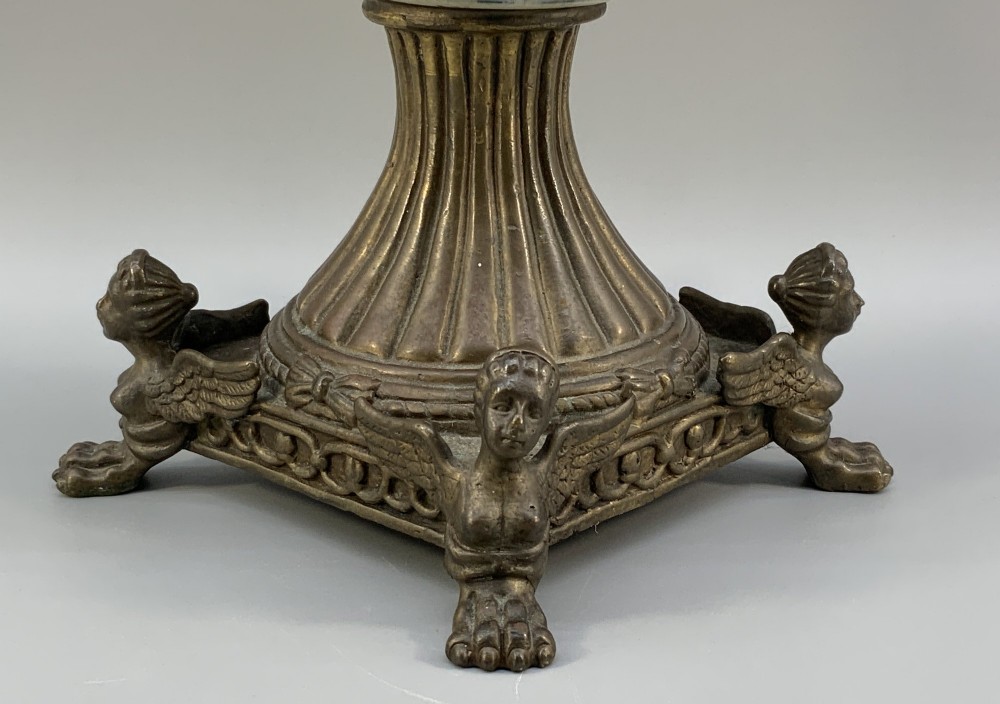 A Renaissance Revival faience vase featuring blue and yellow glazed classical medallion artwork mounted on a cast bronze footed base with mask handles. View XII