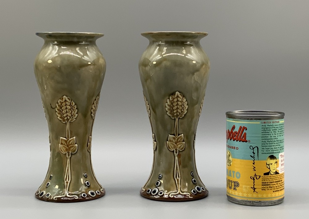A matched pair of Royal Doulton Lambeth Art Nouveau stoneware vases featuring raised relief botanical motifs on a muted olive green glazed ground. View III