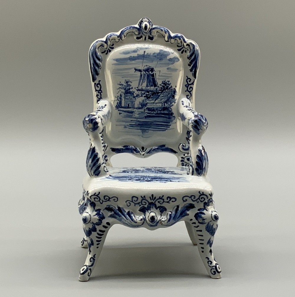 A late 19th-century miniature porcelain armchair glazed in white and hand-painted with blue Dutch landscape scenes featuring a windmill. View IV