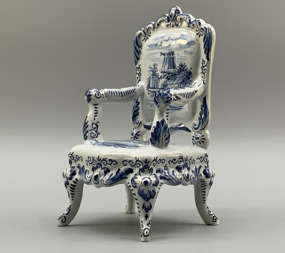 A late 19th-century miniature porcelain armchair glazed in white and hand-painted with blue Dutch landscape scenes featuring a windmill. View VI