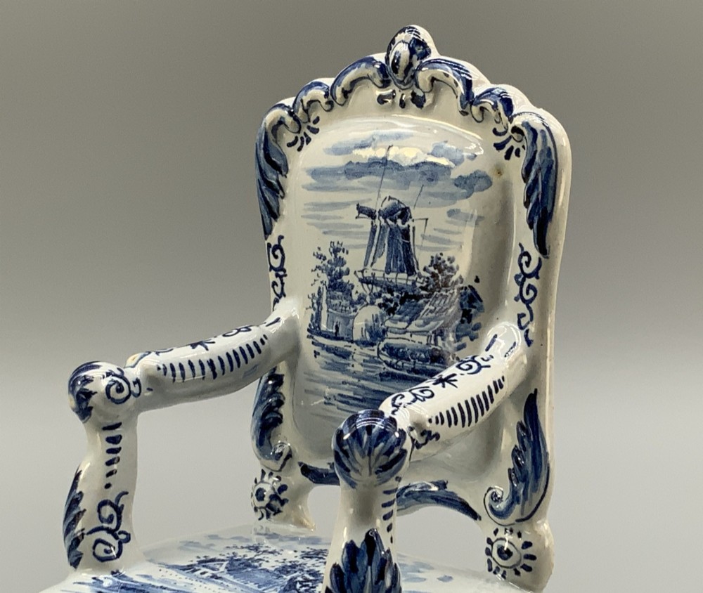 A late 19th-century miniature porcelain armchair glazed in white and hand-painted with blue Dutch landscape scenes featuring a windmill. View VII